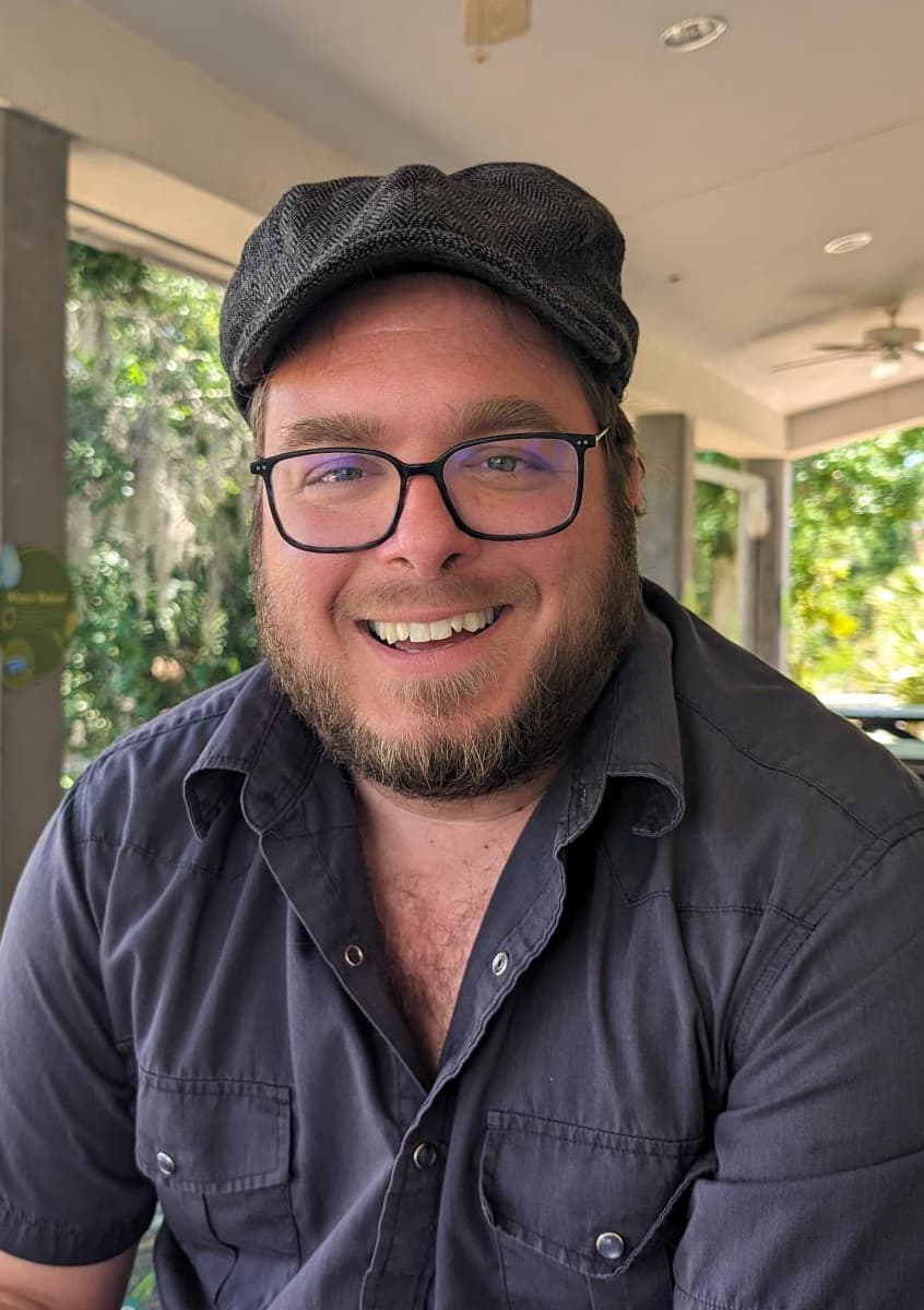 portrait of Dustin smiling at the camera
