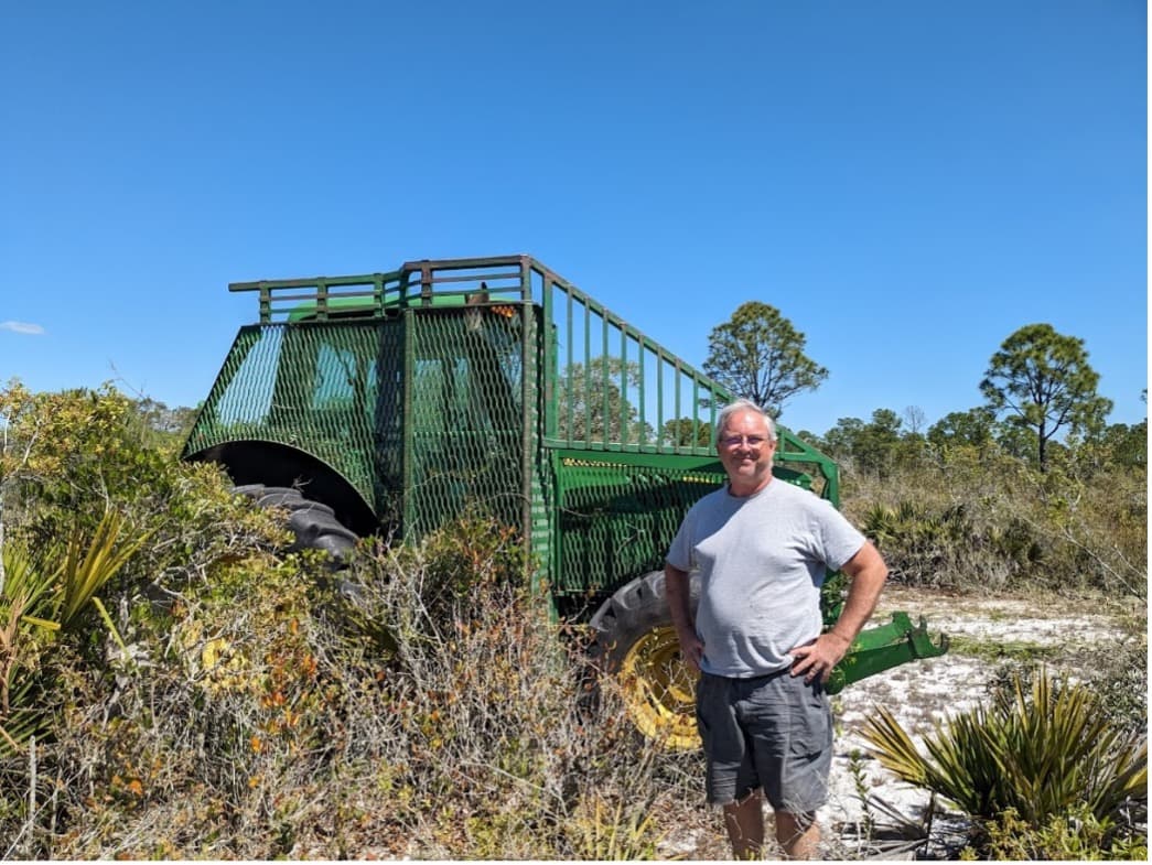 Archbold Land Manager Kevin Main after mowing strips across a disturbed rosemary bald at Archbold Biological Station.