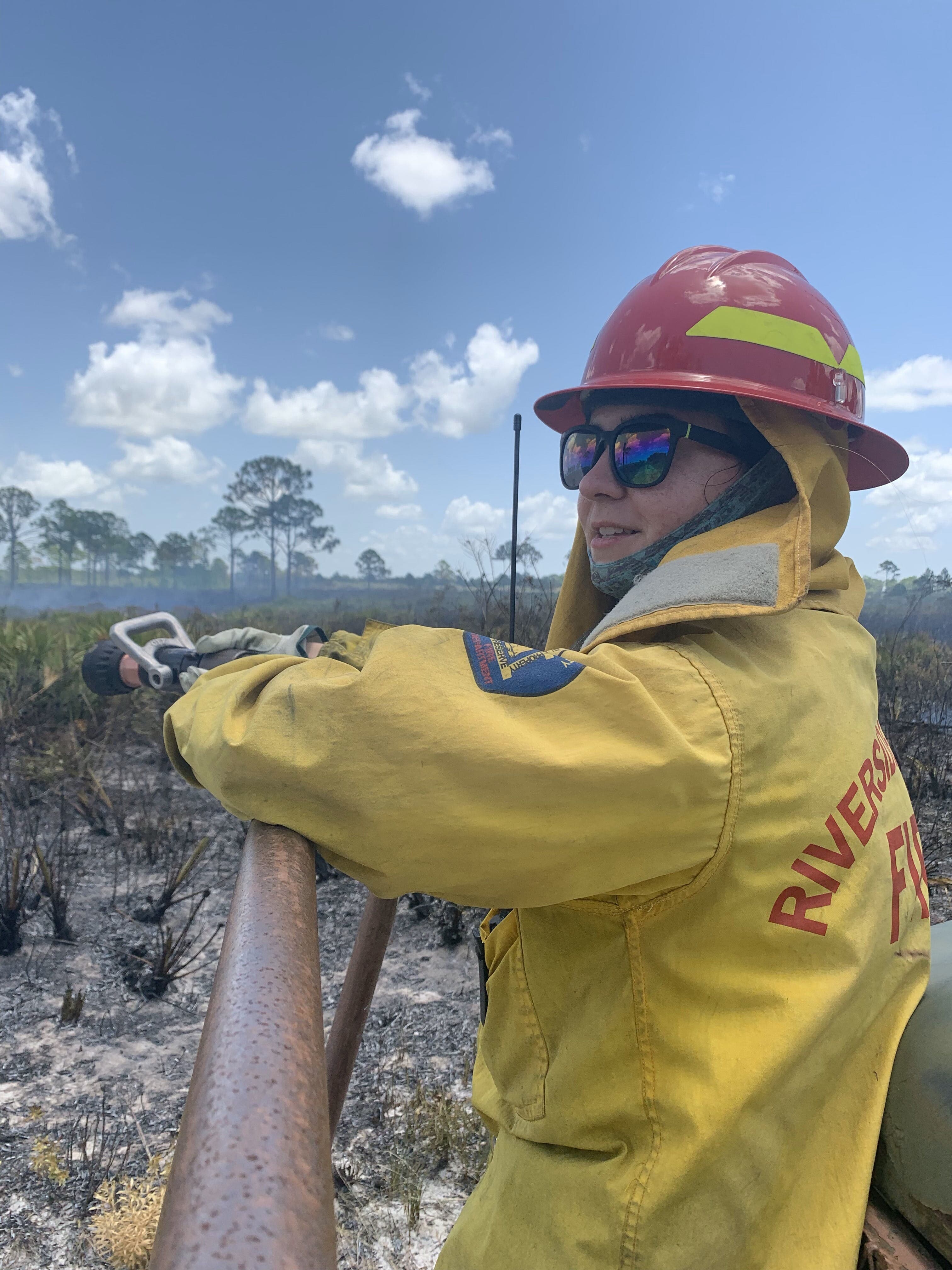 Intern Iris Kennedy working a prescribed burn of the Florida scrub. Photo Credit: Iris Kennedy