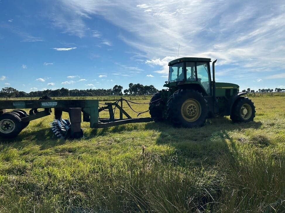 week 286 Tractor aerating the Bahia grass